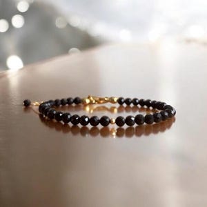 Black tourmaline bracelet with 24k gold-plated details and clasp - Handmade natural stone jewelry