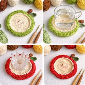 May include: Crocheted apple-shaped coasters in green, red, and cream. The coasters have a detailed design, resembling an apple slice. A glass of water and a decorative crown are placed on the coasters, showcasing their use. Yarn and crochet hooks are also visible.