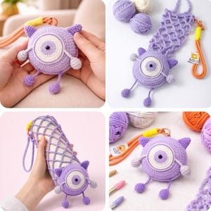 May include: A handmade, crochet monster-themed item in shades of purple, white, and grey. The round body features a large eye, small ears, and dangling feet. The item is shown with a matching bottle holder and yarn.