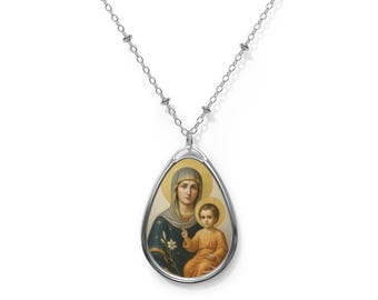 May include: Silver-toned pendant necklace featuring a religious icon of a woman and child. The oval pendant has a gold border and a detailed image of the figures. The chain is a delicate silver with small decorative beads.
