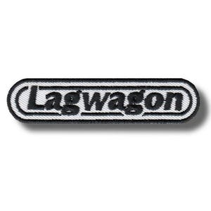May include: Embroidered patch featuring the word "Lagwagon" in black, stylized text. The patch has a white background with a black border, and a black outline around the text. The patch is rectangular with rounded corners.