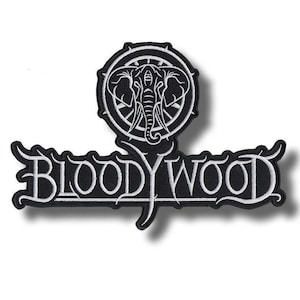 May include: Black and white embroidered patch featuring the band name "BLOODYWOOD" in stylized lettering. Above the name is a circular emblem with an elephant design. The patch is likely for a jacket or bag.