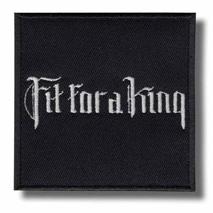 May include: Black square patch with the embroidered text "Fit for a King" in white gothic lettering. The patch has a textured appearance and a subtle shadow effect, suggesting a raised design.