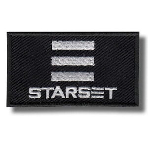 May include: Black embroidered patch with the word "STARSET" in white beneath three horizontal white bars. The patch is rectangular with a black border. The design is simple and striking.