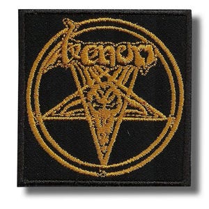 May include: Black square patch with gold embroidered design. The design features the word "Venom" above a gold pentagram within a circle. The patch is likely for clothing or accessories.