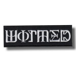 May include: A rectangular black patch with white embroidered text. The text appears to be a stylized word or phrase. The patch has a clean, minimalist design, suitable for application on clothing or accessories.