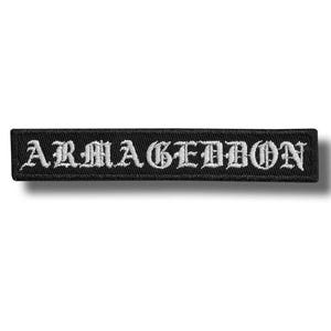 May include: Black rectangular patch with the word "ARMAGEDDON" embroidered in white gothic lettering. The patch is likely made of fabric and has a stitched border. The design is simple and bold.