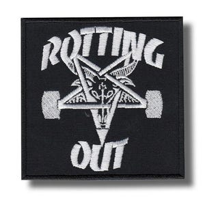 May include: Black square patch with white embroidered text and a pentagram design. The text reads "ROTTING OUT" in a bold, stylized font. The pentagram features a central symbol and is flanked by two wheel-like shapes.