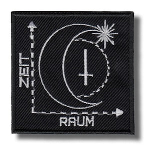 May include: Black square patch featuring a white graphic design. The design includes a crescent moon, a starburst, a cross, and the words "ZEIT" and "RAUM". The patch has a white border.