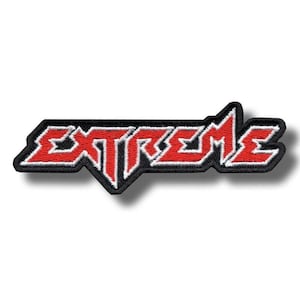 May include: Embroidered patch with the word "EXTREME" in red, outlined in white, on a black background. The patch has a stylized, bold font and a jagged edge design.