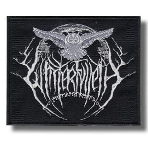 May include: Black embroidered patch with a gray owl design and the word "WINTERVILLETH" in white. The design includes tree branch-like elements and a crescent moon. The patch is rectangular in shape.