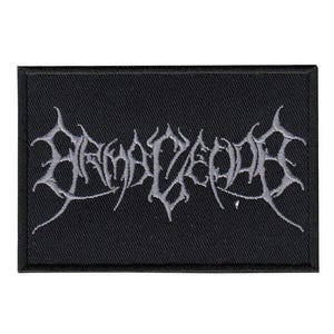 May include: Black rectangular patch featuring the word "BRUTALCEPTS" embroidered in a gothic, stylized font in grey. The patch has a black border and is designed to be sewn onto clothing or accessories.