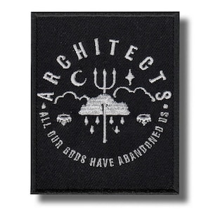May include: Black rectangular patch with white embroidered text and graphics. The text reads "ARCHITECTS" in an arc, with "A-ALL OUR GODS HAVE ABANDONED US" in a circular pattern. The design includes a trident, clouds, and stars.