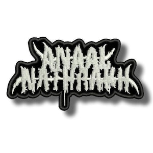 May include: Embroidered patch with the text "ANAAK NATARAK" in a stylized, gothic font. The text is white, with a black border and backing. The patch has a unique, jagged shape.