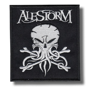 May include: Black embroidered patch featuring the band name "ALESTORM" in white, stylized lettering above a skull design with tentacles and crossed bones. The patch is rectangular.