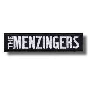 Puede incluir: Parche rectangular negro con el texto "THE MENZINGERS" bordado en blanco. El parche tiene un borde blanco y un efecto de sombra.