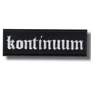 May include: Black rectangular patch with the word "kontinuum" embroidered in white gothic lettering. The patch has a black border and a shadow effect.