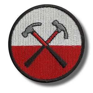 May include: Circular embroidered patch with a design of two crossed hammers. The patch is divided into white and red sections. The hammers are grey with red handles, and the border is black.