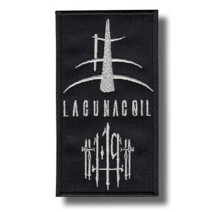 May include: Black rectangular patch with white embroidered design and text. The design features a stylized shape above the text "LAGUNACOIL" and the numbers "119". The patch is likely for clothing or accessories.