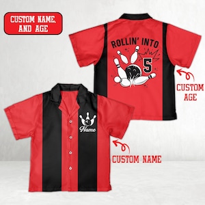 May include: Red and black bowling shirt with a bowling pin graphic and the text "Rollin' Into 5". The shirt has a button-down front and a collar. The shirt also has the text "Custom Name" and "Custom Age".