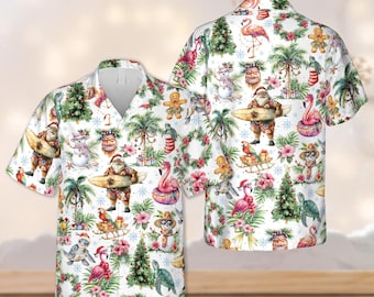 May include: White short-sleeved shirt with a tropical Christmas theme. The shirt features Santa Claus with a surfboard, flamingos, snowmen, palm trees, and Christmas trees. The shirt has a V-neck collar.