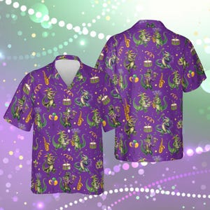 May include: Purple short-sleeved button-down shirt with a repeating pattern of green alligators playing musical instruments. The alligators are wearing festive attire, and the background is filled with musical notes and confetti.