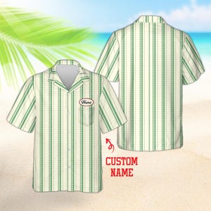 May include: A short-sleeve button-down shirt featuring a vertical striped pattern in shades of green and off-white. The shirt includes a chest pocket with an oval patch displaying the text Name. The design is shown from both front and back views.