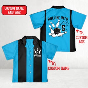 May include: Two bowling-themed shirts. One shirt is light blue with a black vertical stripe and a bowling pin graphic with the word "Name". The other shirt is light blue with a black back and the text "ROLLIN' INTO 5" with a bowling ball and pins.