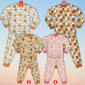May include: Four sets of long-sleeve pajamas featuring a patchwork pattern of pumpkins, leaves, and plaid squares. Set 1 has orange cuffs, set 2 has brown cuffs, set 3 has orange cuffs, and set 4 has pink cuffs with a pink, white, and green pattern.