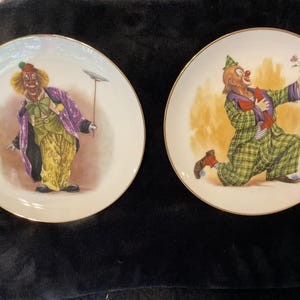 pair of vintage romeo & rascal the clown decorative plates.