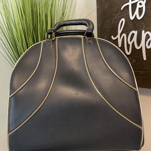 bolsa vintage de couro para bola de boliche.