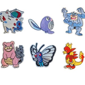 May include: A collection of six embroidered patches depicting cartoon characters in various colours. The patches include a blue and white creature, a purple creature with a tail, a muscular blue figure, a pink creature, a butterfly, and a red and yellow creature.