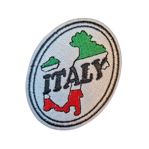 May include: Oval patch with the word "ITALY" in black, a green and red map outline, and a white background. The patch is edged with black stitching.