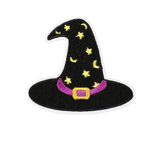 May include: A black witch's hat patch with a purple band and gold buckle. The hat is decorated with yellow stars and crescent moons. The patch has a white border.