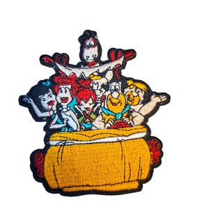 May include: An embroidered patch featuring a group of cartoon characters from The Flintstones, including Fred, Wilma, Barney, Betty, Pebbles, and Bamm-Bamm, all gathered inside a large, yellow, rounded container with a black border outline.