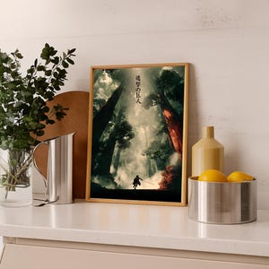 May include: A framed art print featuring a forest scene with a figure holding a sword. The artwork has a vertical orientation and is set in a wooden frame. Japanese text is visible at the top of the print.