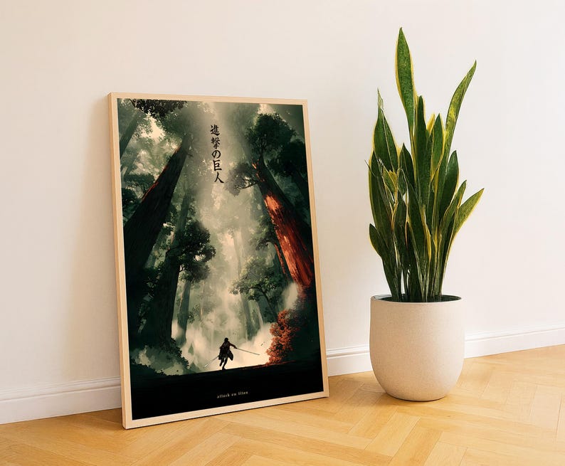 May include: A framed art print featuring a dramatic forest scene with a silhouetted figure holding a sword. The artwork has a dark, atmospheric quality with towering trees and a misty background. Japanese text is visible at the top of the print, with the words "attack on titan" at the bottom.