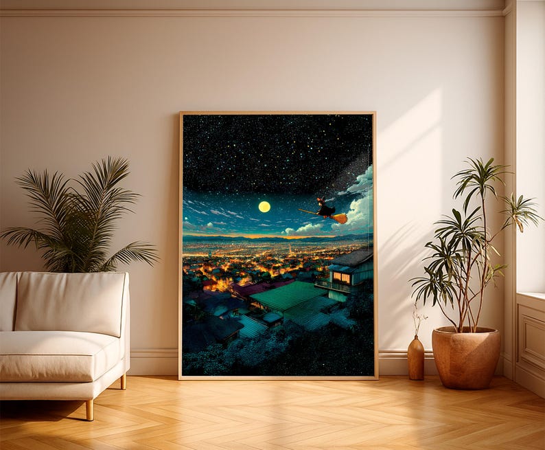 May include: A framed art print depicts a night scene with a witch flying on a broom over a city. The artwork features a starry sky, a full moon, and the city lights below. The print is displayed in a room with a sofa and plants.