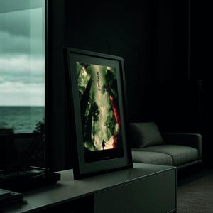 May include: A framed art print featuring a dark, dramatic scene with a silhouetted figure in a forest. The artwork has a color palette of greens, reds, and blacks. The Japanese text is visible on the top left of the print.