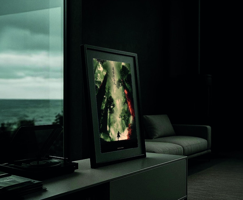 May include: A framed art print featuring a dark, dramatic scene with a silhouetted figure in a forest. The artwork has a color palette of greens, reds, and blacks. The Japanese text is visible on the top left of the print.