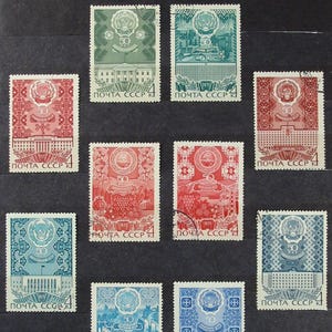 May include: A collection of vintage postage stamps, featuring various designs and colors. The stamps showcase architectural elements, floral patterns, and the number "50". The text "ПОЧТА СССР" is visible on each stamp.