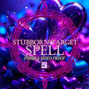 May include: A digital graphic featuring multiple glossy, glittery purple and blue hearts. A circular, ornate magenta frame overlays the center, containing the white text STUBBORN TARGET SPELL, PHOTO & VIDEO PROOF, and a small movie camera icon.