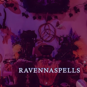 May include: A mystical altar scene with a purple and pink color scheme. The text "RAVENNASPELLS" is displayed. The altar features candles, jars, and decorative elements, including antlers and a dream catcher, creating a magical atmosphere.