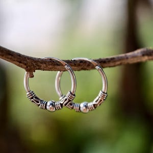 May include: A rustic wooden sign with the text "Welcome to our home" in white lettering. The sign features a distressed finish and a simple, inviting design, perfect for a front porch or entryway.