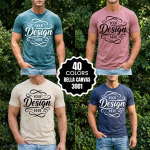 Könnte beinhalten: Vier T-Shirts in den Farben Türkis, Mauve, Beige und Marineblau, jeweils mit dem Text "Your Design Here" in dekorativer Schrift. Die Shirts sind Bella Canvas 3001, mit einem Etikett, das 40 verfügbare Farben anzeigt.
