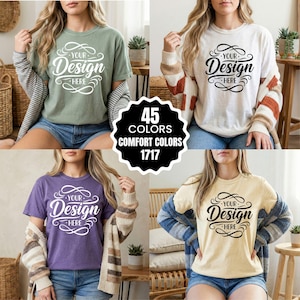 May include: Four t-shirts in different colors: sage green, off-white, purple, and pale yellow. Each shirt has the text "YOUR Design HERE" in a decorative script. A circular graphic states "45 COLORS COMFORT COLORS 1717".
