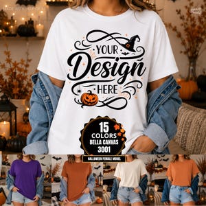 Puede incluir: Una camiseta blanca de manga corta con un gráfico negro que muestra un sombrero de bruja, una calabaza y el texto "YOUR DESIGN HERE". Debajo del gráfico hay una insignia circular con el texto "15 COLORS BELLA CANVAS 3001 HALLOWEEN FEMALE MODEL".