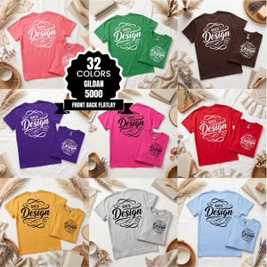 May include: A flat lay of various Gildan 5000 t-shirts in multiple colors, including pink, green, purple, red, yellow, gray, and blue. Each shirt features the text "BACK Design" in a decorative script. The image also includes a graphic indicating 32 colors.