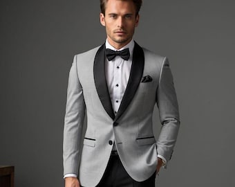 Traje de esmoquin gris de corte entallado con solapa de satén negro para novio de boda.