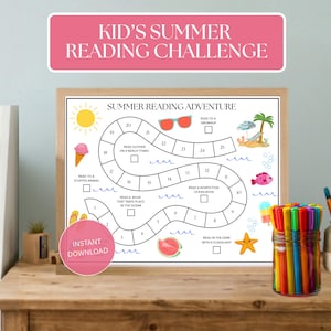 May include: A framed "Summer Reading Adventure" game board with colorful illustrations of summer activities. The board includes the text "Kid's Summer Reading Challenge" and is accompanied by a jar of colorful markers.